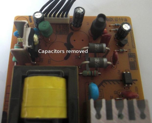 faulty capacitors removed from PSU board