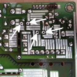 capacitors removed showing holes left by the leads
