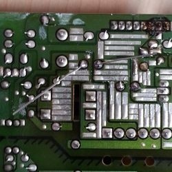 Solder the capacitor leads from underside of board